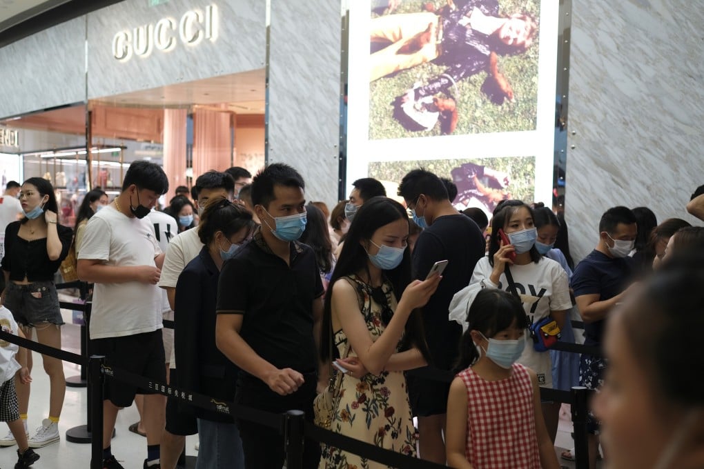 Customers line up to enter a Gucci store in a duty-free shopping centre in Hainan, southern China. Growing duty-free, in-store and e-commerce sales of luxury goods in the country this year have led global luxury brands to plan expansion in China, as sales slump elsewhere amid Covid-19. Photo: Reuters