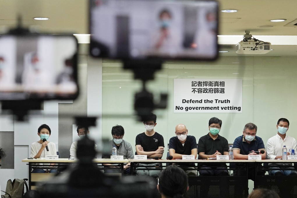 Media organisation representatives attend a press conference in Hong Kong on September 24 to protest against new rules restricting who can provide press coverage during demonstrations, saying the government has no right to determine who is or isn't a reporter. Photo: AP