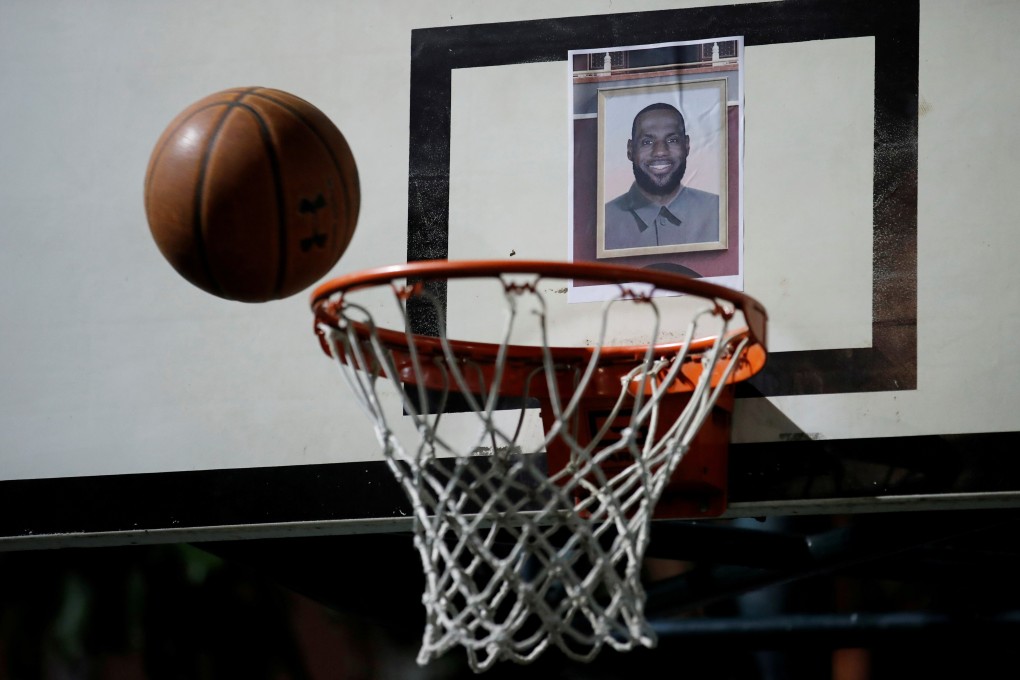 A basketball thrown at a hoop with LeBron James on the backboard at a gathering supporting Houston Rockets GM Daryl Morey in Hong Kong in October, 2019. Photo: Reuters