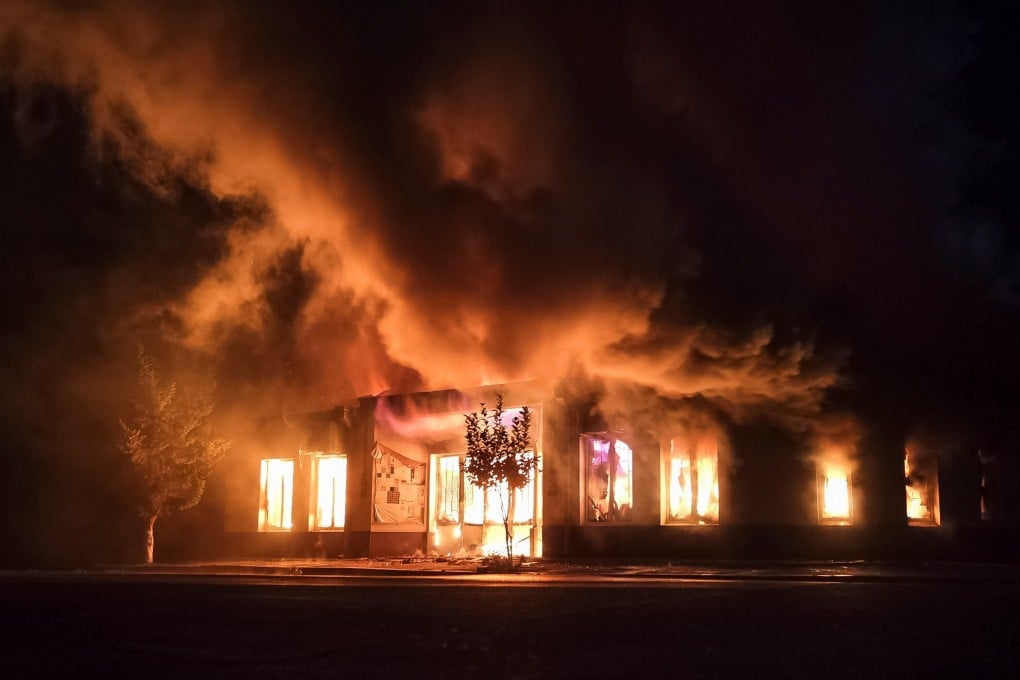 A shop is seen on fire following recent shelling during a military conflict over the breakaway region of Nagorno-Karabakh on Saturday. Photo: Reuters