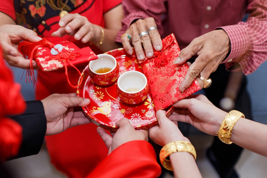 A bride and groom take part in a traditional tea ceremony, a key event during Chinese weddings. The notion that a child is best raised in a family with a mother and a father is still strong in Hong Kong culture. Photo: Shutterstock