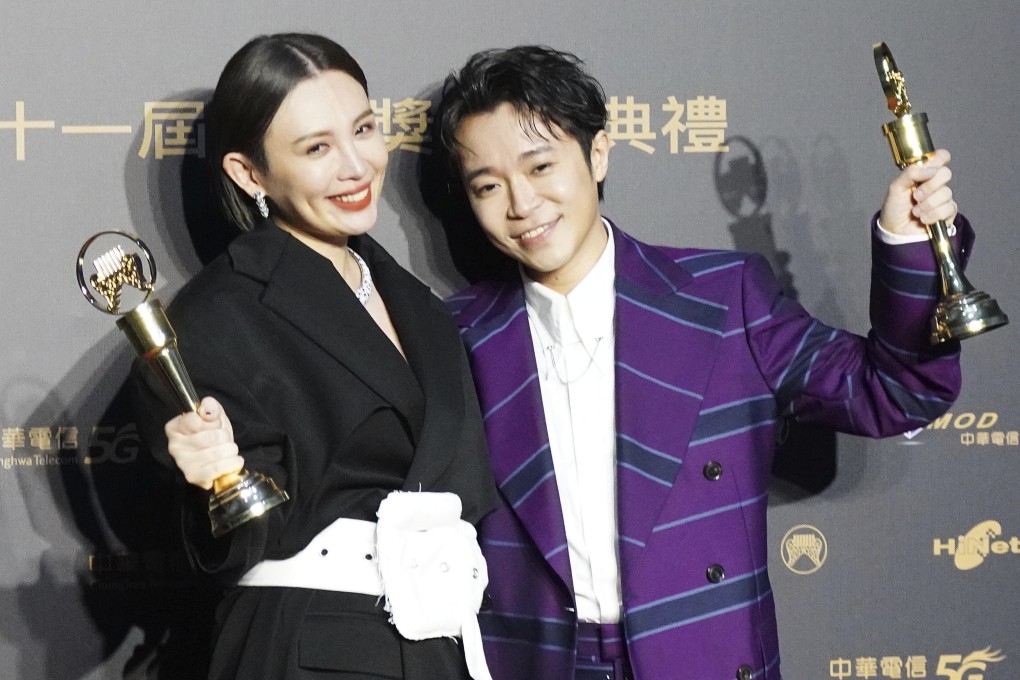 Taiwanese singers Waa Wei (left) and Wu Qingfeng hold their awards for best Mandarin female and male vocalists at the 31st Golden Melody Awards in Taipei, Taiwan, on Saturday. Photo: AP