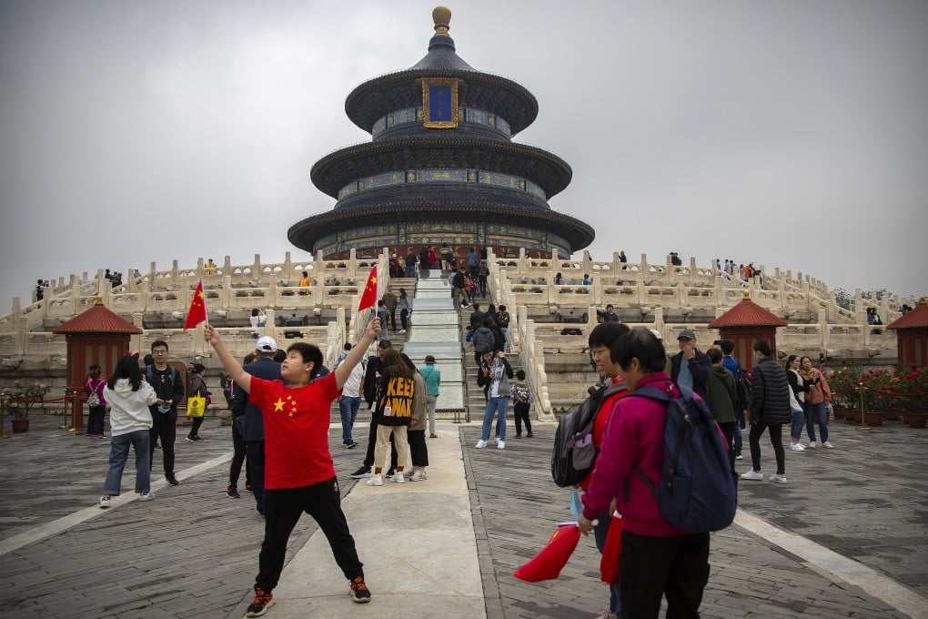 Not everyone who visited the temple of Heaven in Beijing on Thursday observed the China CDC’s advice on wearing face masks. Photo: AP