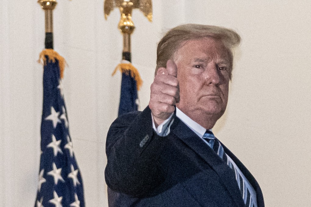 US President Donald Trump gives a thumbs-up after returning to the White House on Monday following several days at Walter Reed National Military Medical Center. Photo: EPA-EFE