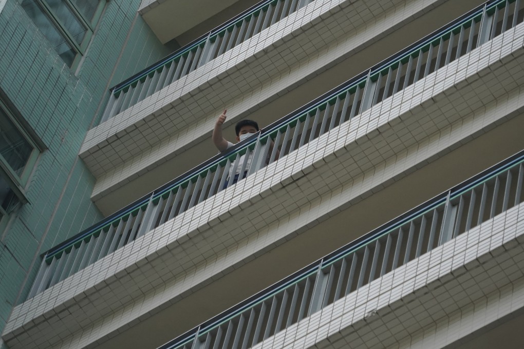 A student waves to the media at Alliance Primary School in Kowloon Tong. Photo: Felix Wong
