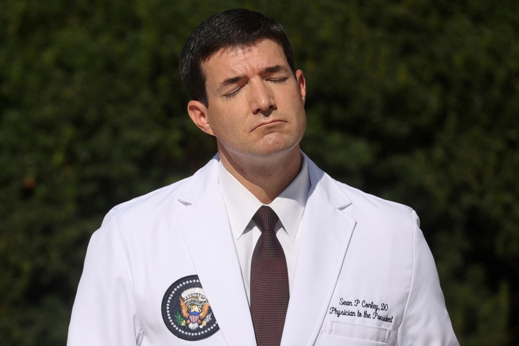 White House doctor Sean Conley closes his eyes as he looks into the sun during a news conference about US President Donald Trump’s health on Monday. Photo: Reuters