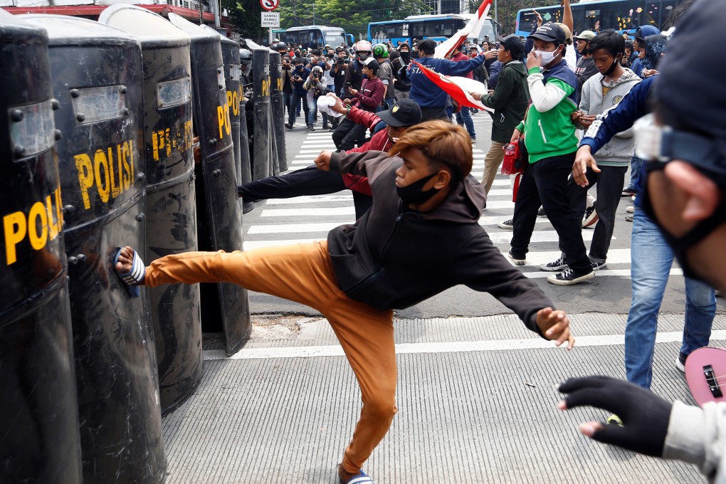 Demonstrators clash with police officers in Jakarta on October 8, 2020. Photo: Reuters