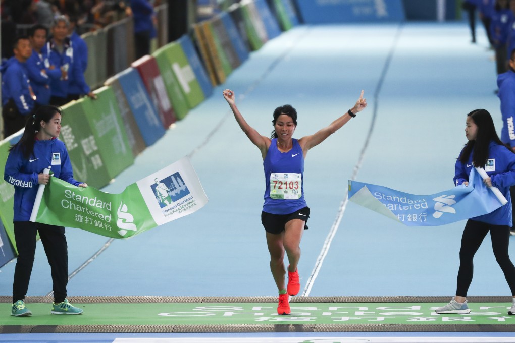 Christy Yiu Kit-ching wins the women’s half marathon at the 2019 Standard Chartered Hong Kong Marathon, in Victoria Park, Causeway Bay. Photo: Nora Tam