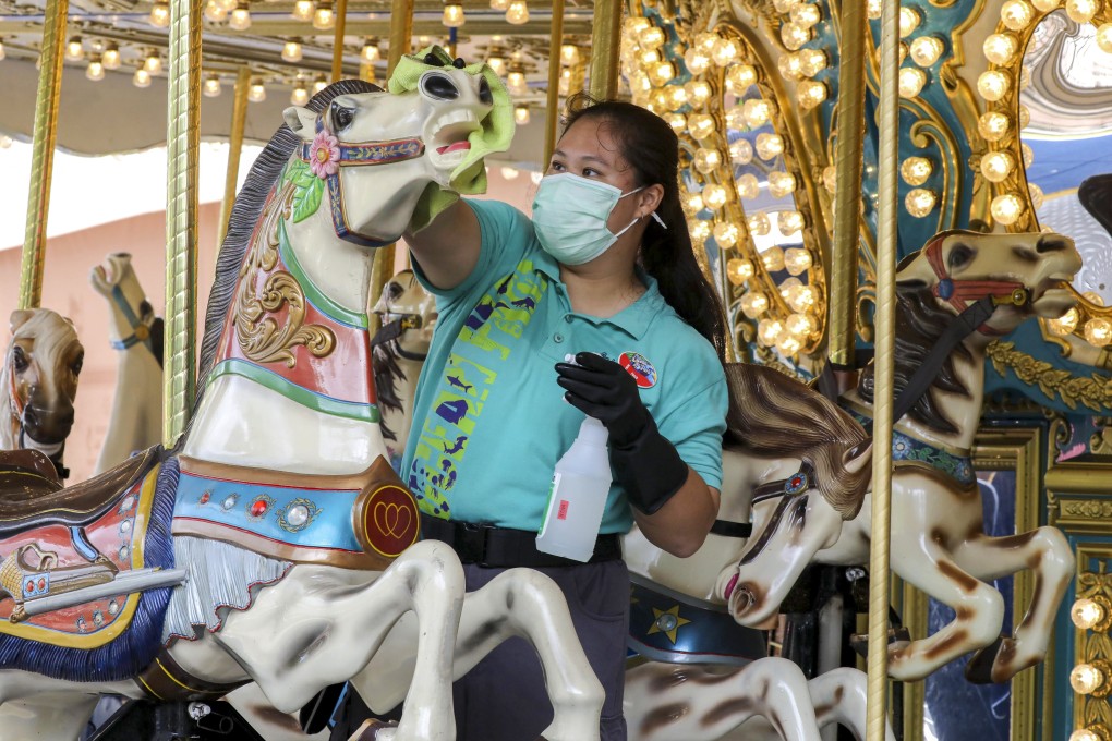 A worker carries out cleaning at Ocean Park, which has expressed an interest in joining the new scheme. Photo: K. Y. Cheng