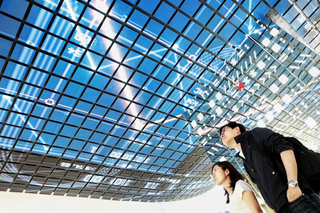 Visitors walk through a display at the National Big Data Comprehensive Pilot Area in southwest Guizhou province on May 22, 2019. Chinese firms are increasingly turning to big data to help reduce their dependence on exports and strengthen their presence in domestic markets. Photo: Xinhua