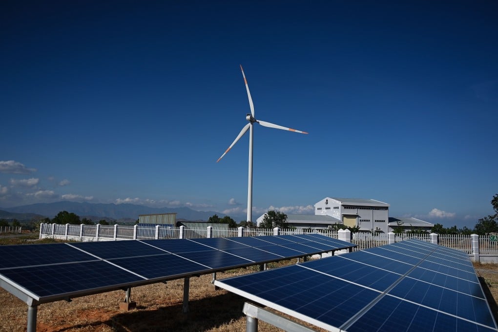 Solar panel installations and a wind turbine at the Phu Lac wind farm in southern Binh Thuan province in Vietnam on April 23, 2019. Vietnam has invested heavily in its solar capacity in recent years, making it one of the region’s leaders in renewable energy. Photo: AFP