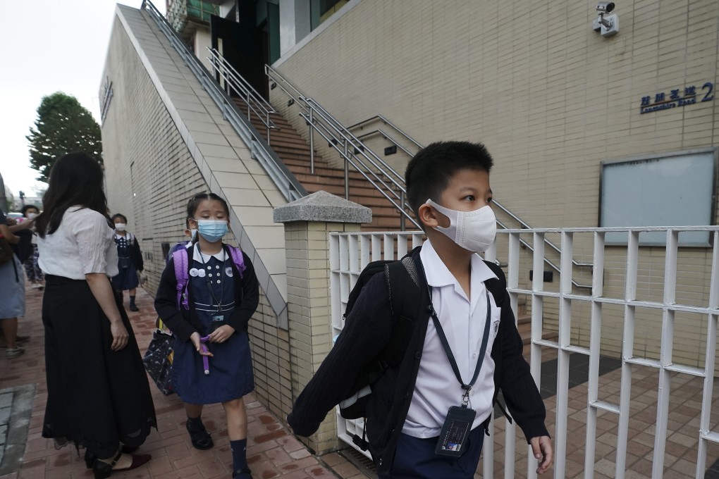 Students file into the Alliance Primary School in Kowloon Tong, where a teacher was disqualified over a lesson plan touching on independence. Photo: Felix Wong