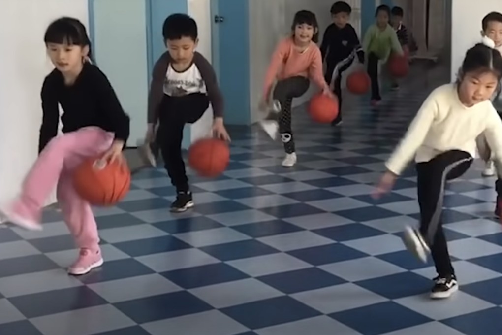 Children at a Chinese kindergarten bounce basketballs in the corridor. Photo: YouTube