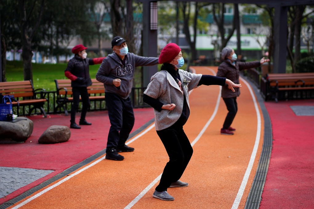 People exercise in a Shanghai park in March. Air quality improved during China’s coronavirus lockdowns, as travel and industry ground to a halt. Photo: Reuters
