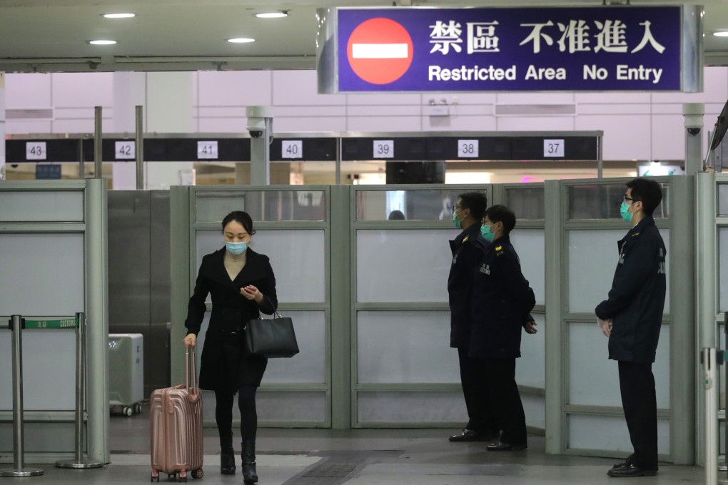 A woman crosses the Lo Wu border before it was closed due to the pandemic. Photo: Edmond So