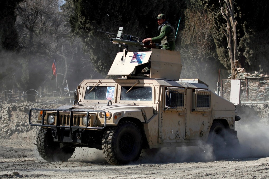 An armoured vehicle patrols near the site of an incident where two US soldiers were killed in February in Nangarhar province, Afghanistan. Photo: Reuters