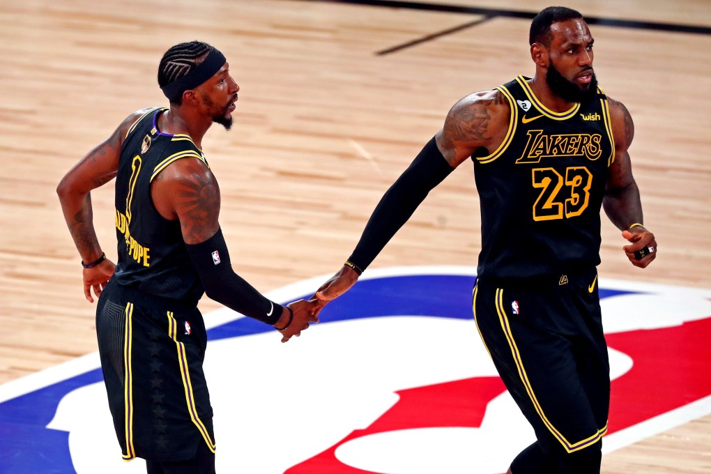 Los Angeles Lakers guard Kentavious Caldwell-Pope celebrates with forward LeBron James after making a three pointe against the Miami Heat in game five of the 2020 NBA Finals. Photo: USA Today Sports
