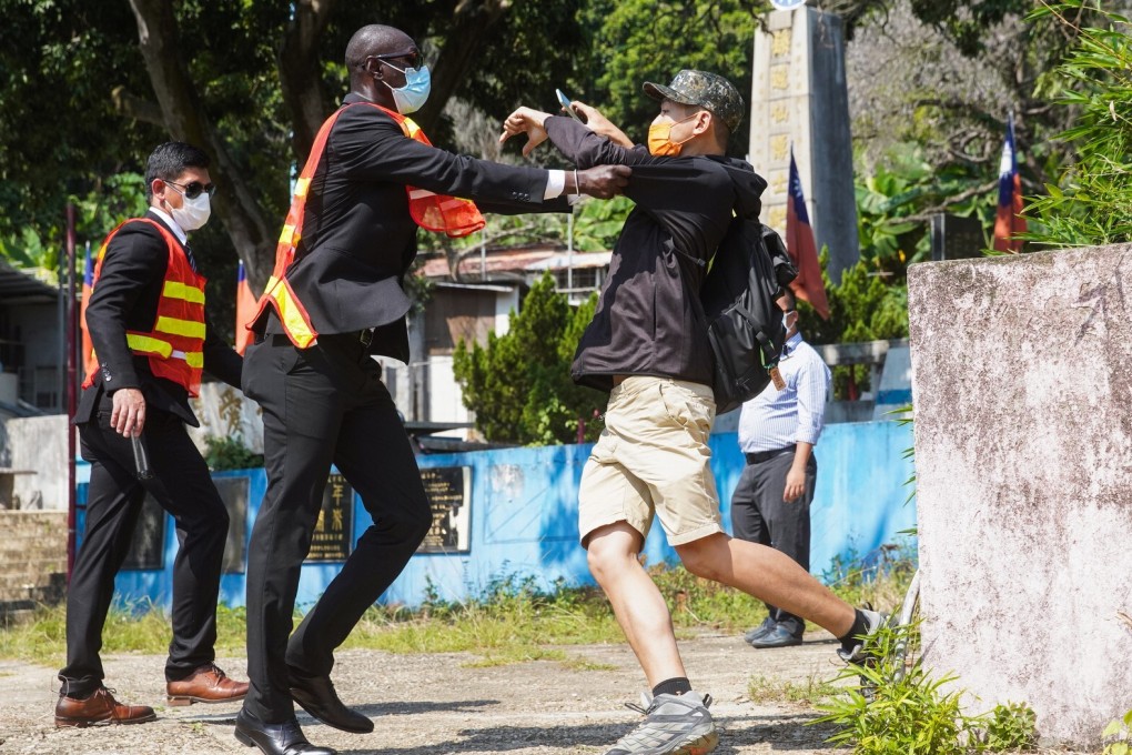A scuffle erupts between a Taiwanese supporter and a security guard at Sun Yat-sen Garden in Tuen Mun on Saturday. Photo: Winson Wong