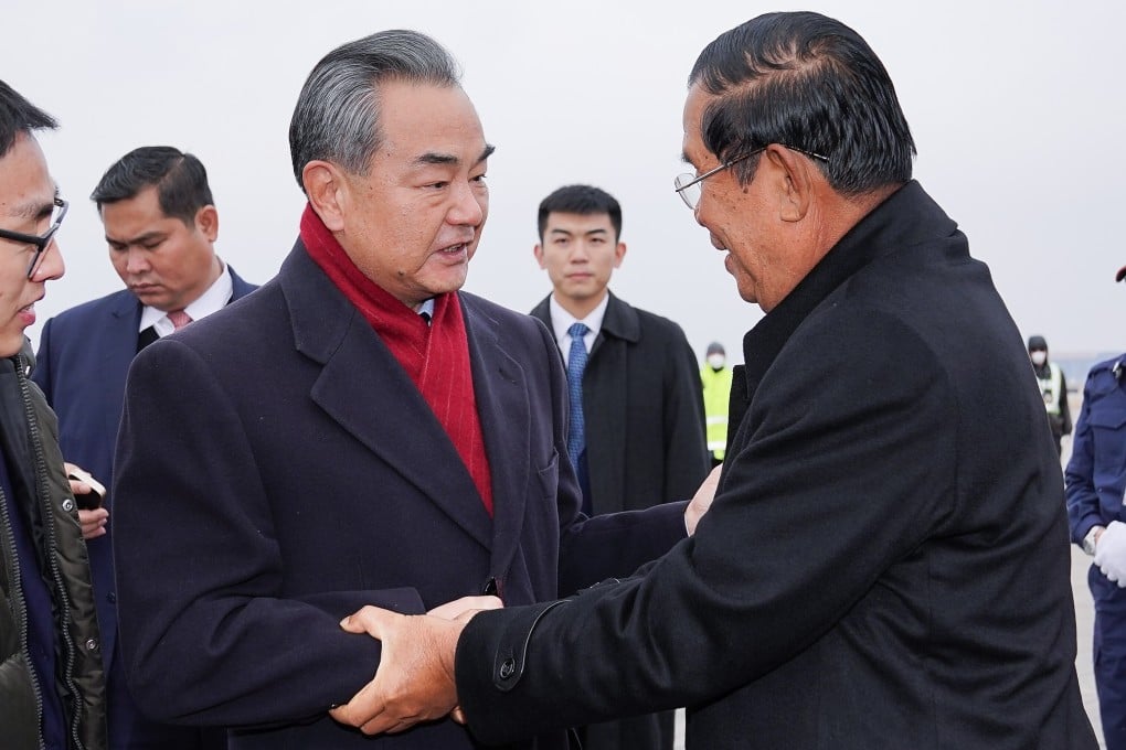 Chinese Foreign Minister Wang Yi greets Cambodian Prime Minister Hun Sen in Beijing on February 5, 2020. Photo: Xinhua
