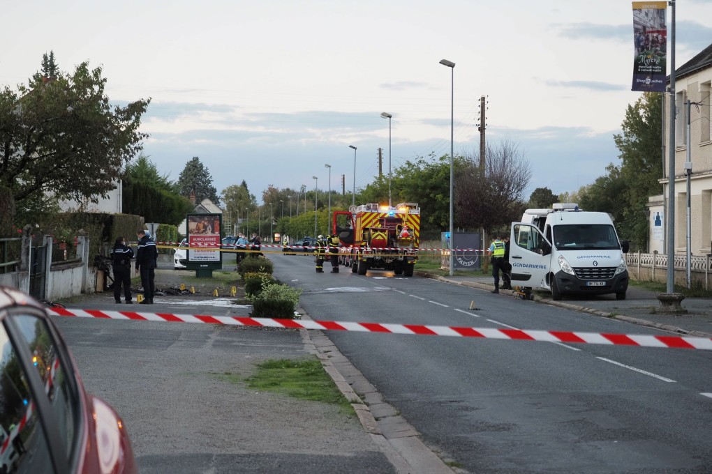 French gendarmes and firefighters work next to the site of a plane crash in Loches, France, on Saturday. Photo: AFP