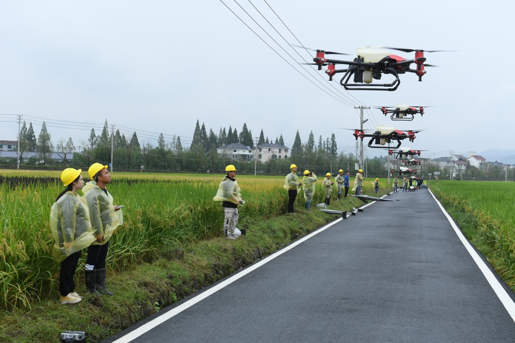 Drone controllers demonstrate operation of drones in Datong Town of Jiande City, Zhejiang Province. Photo: Xinhua