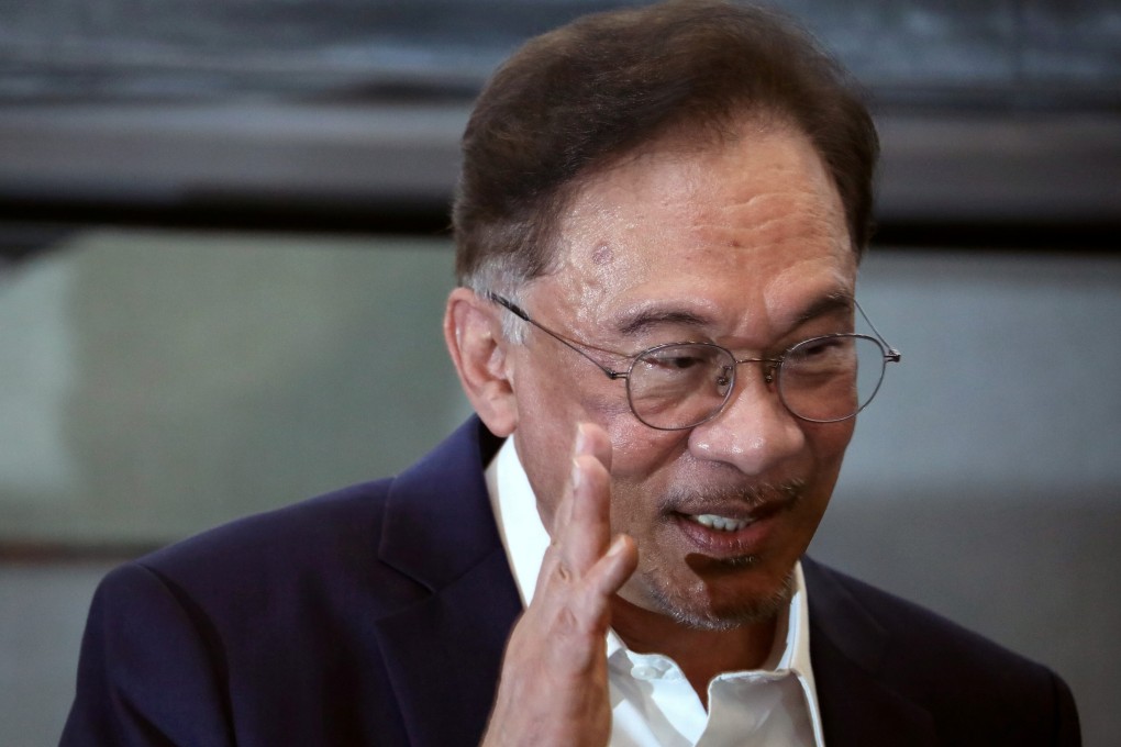 Malaysian opposition leader Anwar Ibrahim waves after the news conference last month in which he announced he had enough support to topple the government of Muhyiddin Yassin. Photo: Reuters