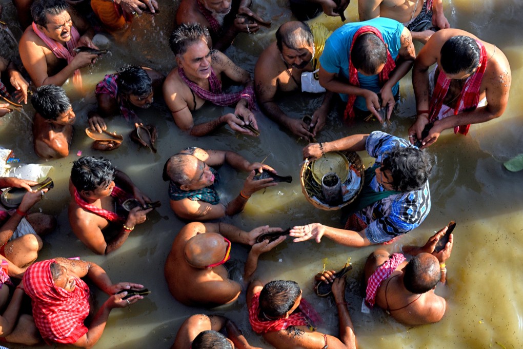 Hindu devotees perform rituals in the Ganges river. India is anticipating a fresh surge in cases with religious festivals this and next month. Photo: DPA
