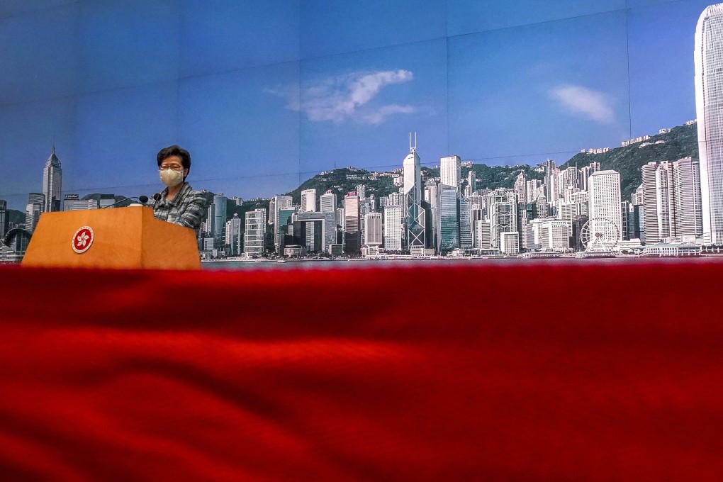 Chief Executive Carrie Lam speaks to the press about the postponement of her annual policy address on Monday. Photo: Felix Wong