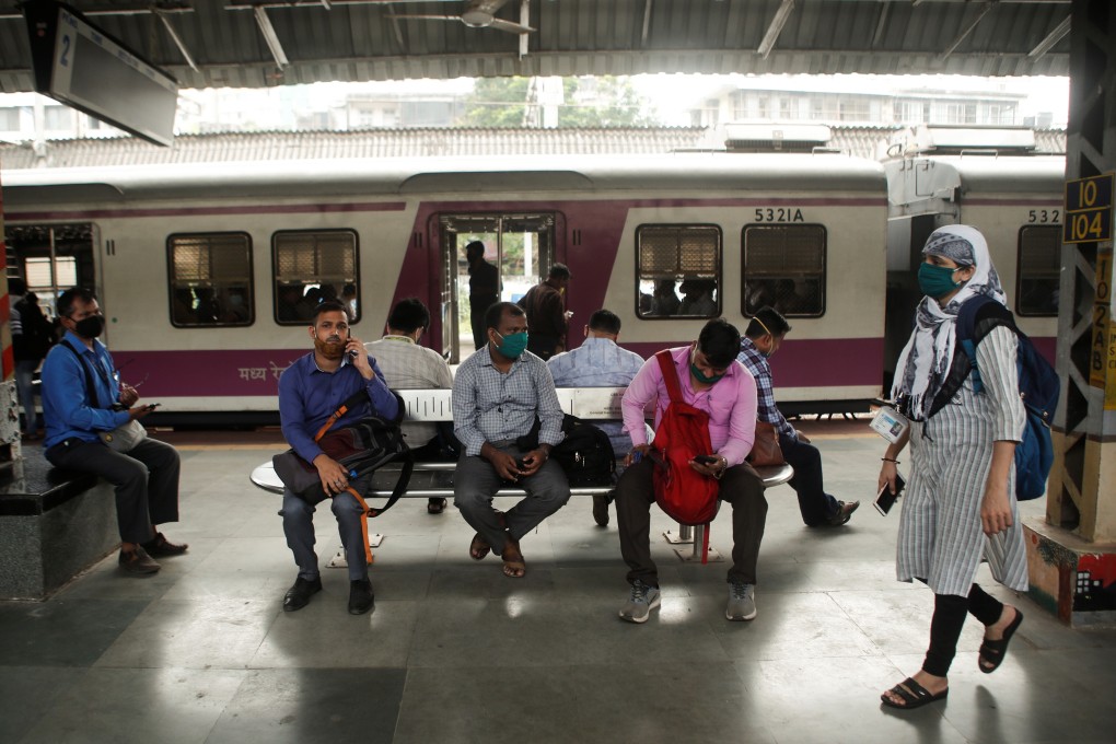 Commuters wait on a railway platform after trains were stalled during a power outage in Mumbai. Photo: Reuters