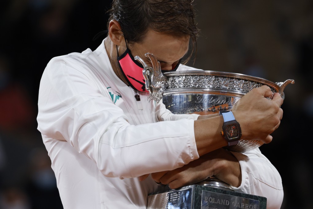 Rafael Nadal holds his trophy after winning against Novak Djokovic in their French Open men’s final in Paris on Sunday. Photo: EPA-EFE
