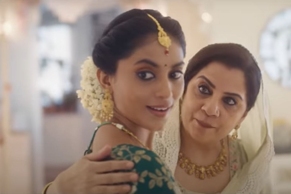 A still from Tanishq‘s pulled ’Ekatvam’ advert shows the pregnant Hindu wife character being escorted to her baby shower by an older Muslim woman she calls mother. Photo: YouTube