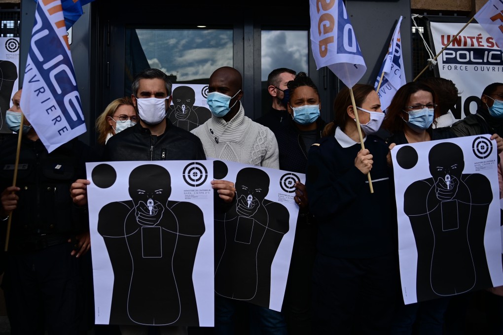 French police holding training targets gather in front of the police station of Champigny-sur-Marne, outside Paris. Photo: AFP