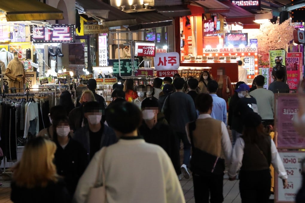 A street in Hongdae, one of the busiest entertainment districts in Seoul, is crowded with people after South Korea eased Covid-19 social distancing rules. Photo: EPA-EFE