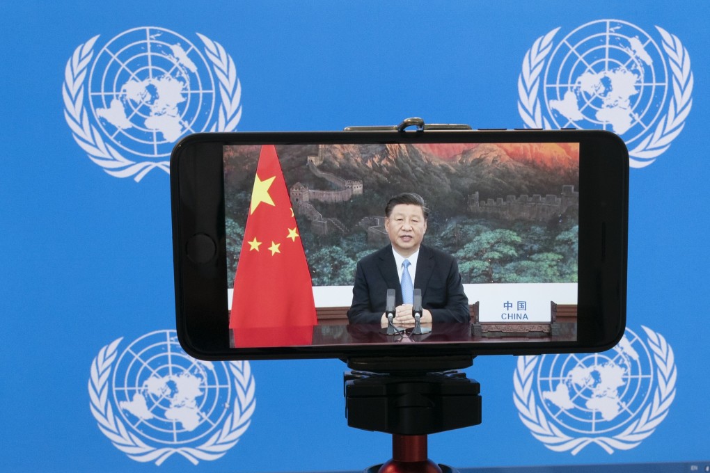 Chinese President Xi Jinping is seen on a phone screen as he remotely addresses the 75th session of the United Nations General Assembly on September 22. Photo: AP