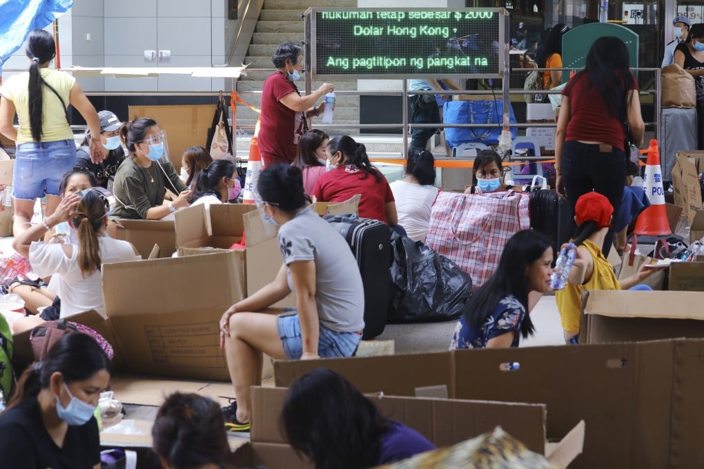 Helpers gather in Chater Road in Central on August 9. The death of a helper from ovarian cancer has once again raised questions about the working conditions for this category of employees. Photo: Dickson Lee