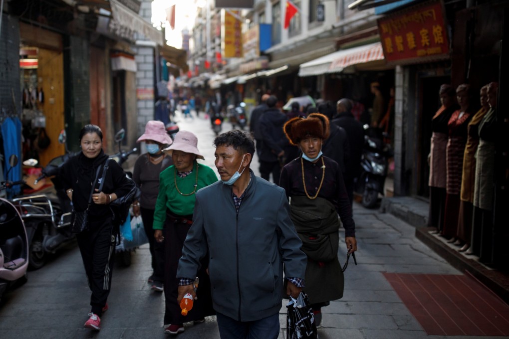 People walk in a market alley in the old city of Lhasa, during a government organised tour of the Tibet autonomous region, China on Wednesday. Photo: Reuters