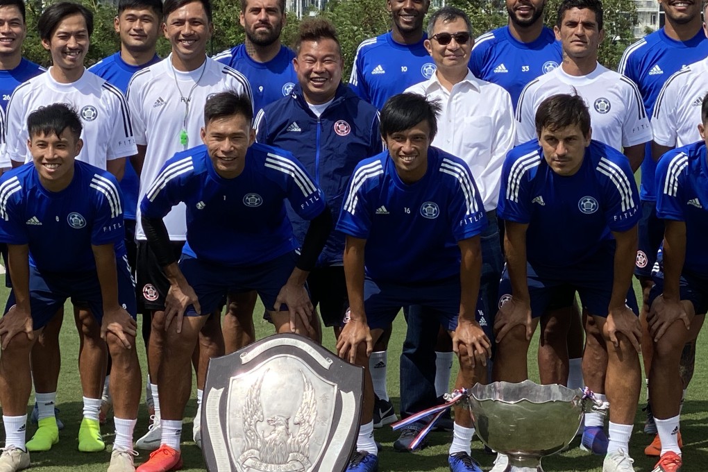 Eastern players pose with their two trophies from the previous season – the Senior Shield and FA Cup. Photo: Chan Kin-wa
