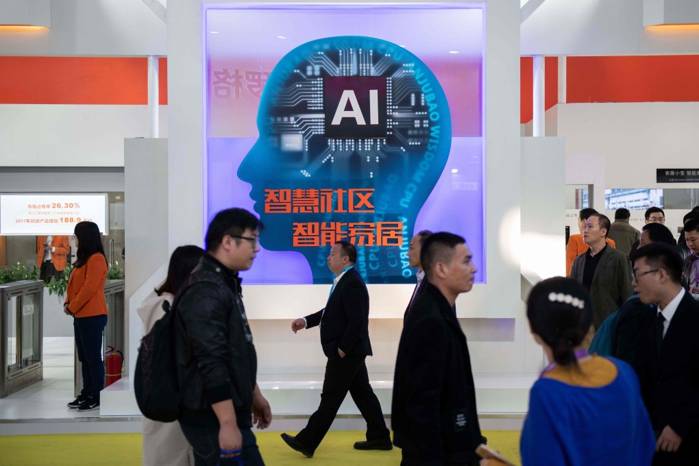 Visitors walk past an AI booth at the 14th China International Exhibition on Public Safety and Security in Beijing on October 24, 2018. Photo: AFP