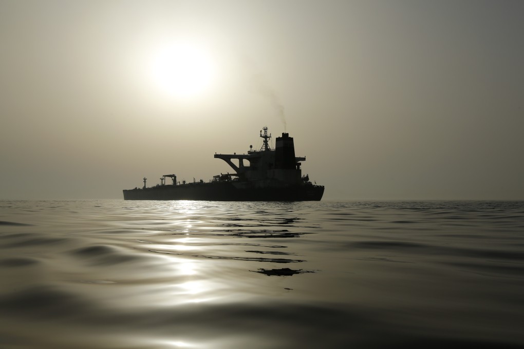 The impounded Iranian crude oil tanker, Grace 1, is silhouetted as it sits anchored off the coast of Gibraltar on Saturday, July 20, 2019. Tensions have flared in the Strait of Hormuz in recent weeks as Iran resists US sanctions that are crippling its oil exports and lashes out after the seizure on July 4 of one of its ships near Gibraltar. Photo: Bloomberg