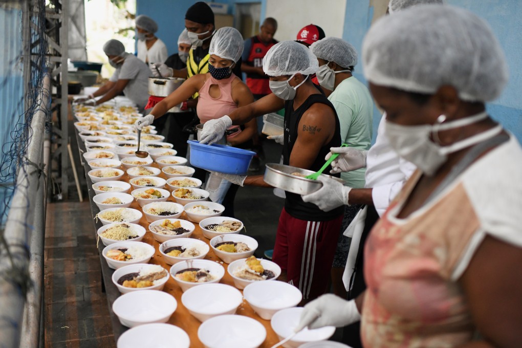Residents of a slum prepare food to distribute to homeless people in the Copacabana neighbourhood, during a coronavirus disease outbreak in Rio de Janeiro, Brazil, on April 11. Photo: Reuters