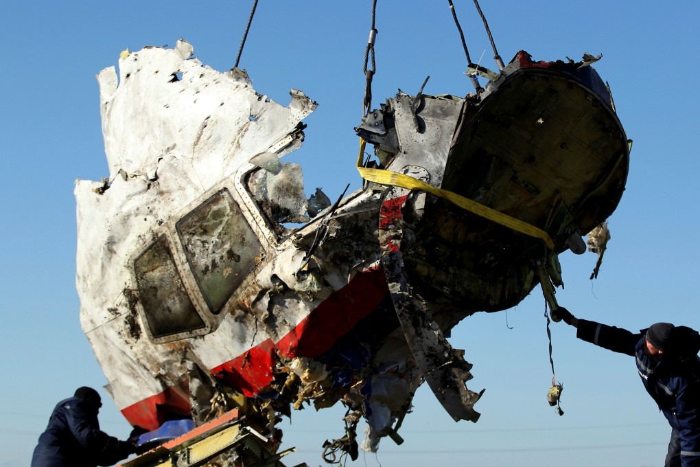 A piece of the MH17 wreckage is lifted at the crash site in Donetsk, Ukraine. File photo: Reuters