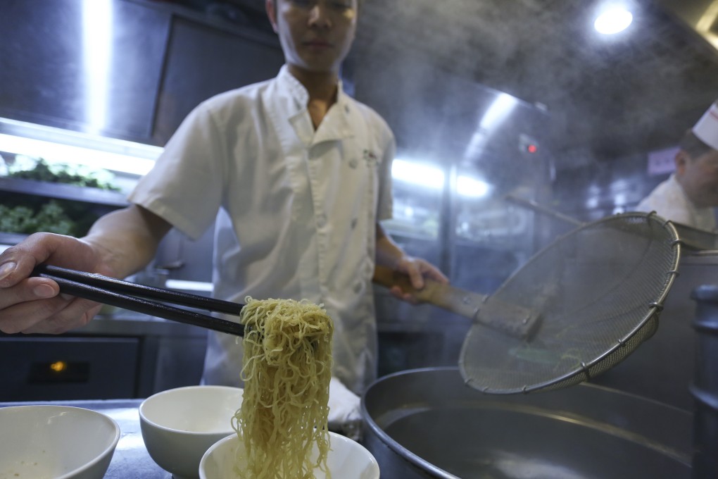 A chef prepares wonton noodles at Ho Hung Kee in Causeway Bay. The umami of the filling, the size of the wontons and how many you get in a bowl, as well as the price, are all factors the discerning Hong Kong diner takes into consideration when choosing where to eat the classic Cantonese dish. Photo: Jonathan Wong