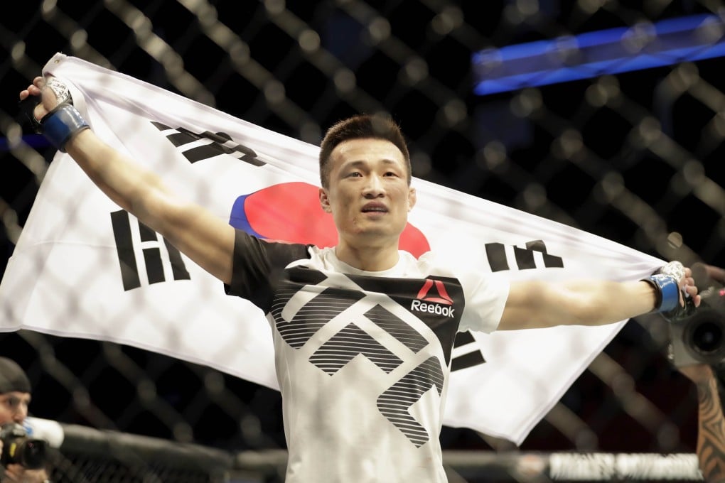 Jung Chan-sung celebrates after defeating Dennis Bermudez in their featherweight bout during the UFC Fight Night event at the Toyota Center on February 4, 2017 in Houston, Texas. Photo: AFP