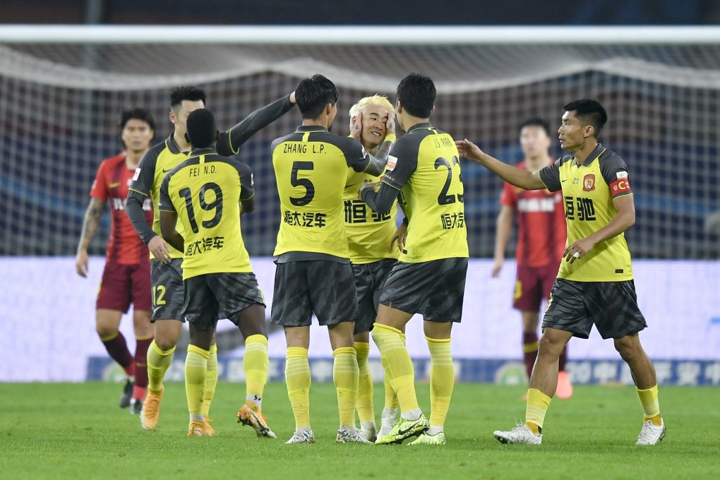 Wei Shihao (centre) celebrates his goal with Guangzhou Evergrande teammates in the Chinese Super League match against Hebei China Fortune. Photo: Xinhua