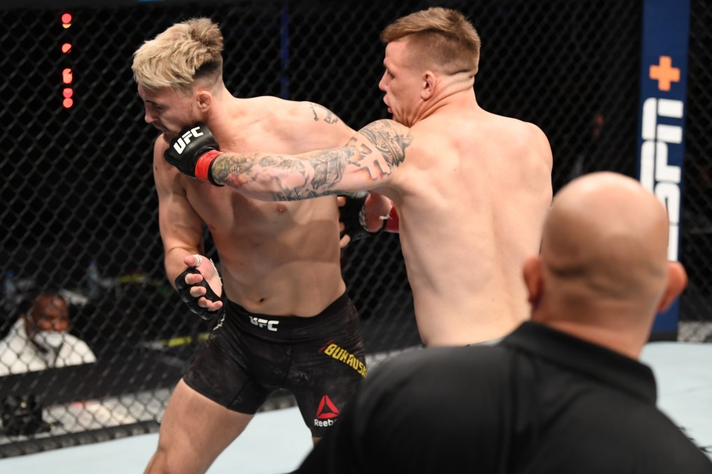 Jimmy Crute punches Modestas Bukauskas in their light heavyweight bout during the UFC Fight Night event inside Flash Forum on UFC Fight Island on October 18, 2020 in Abu Dhabi, United Arab Emirates. Photo: Josh Hedges/Zuffa LLC via Getty Images