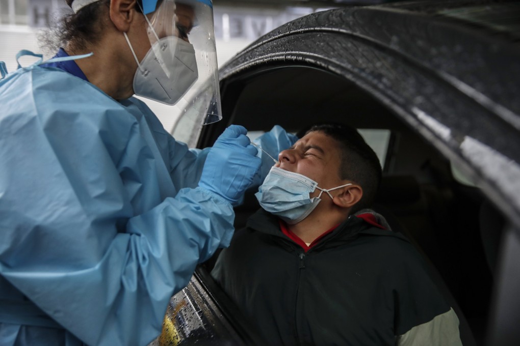 A medical staff takes a swab from a boy to test for Covid-19 at a hospital in Milan, on Thursday. Coronavirus infections are surging again in Europe. Photo: AP Photo