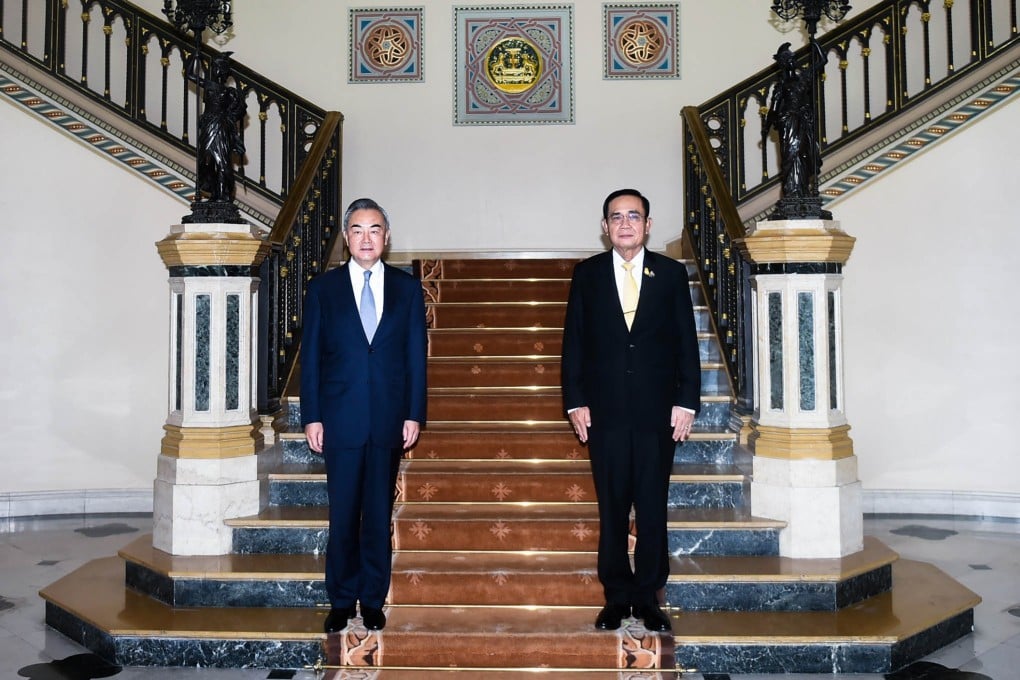 China’s Foreign Minister Wang Yi with Thailand’s Prime Minister Prayuth Chan-ocha at Government House in Bangkok. Photo: AFP