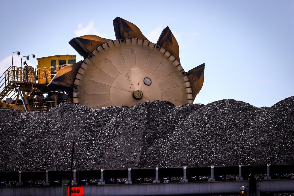 A bucket-wheel reclaimer sits next to a pile of coal at the port in Newcastle, Australia, on October 12. President Xi Jinping’s pledge to make China carbon neutral by 2060 and continued tensions between Beijing and Canberra have clouded the outlook for the Australian dollar. Photo: Bloomberg