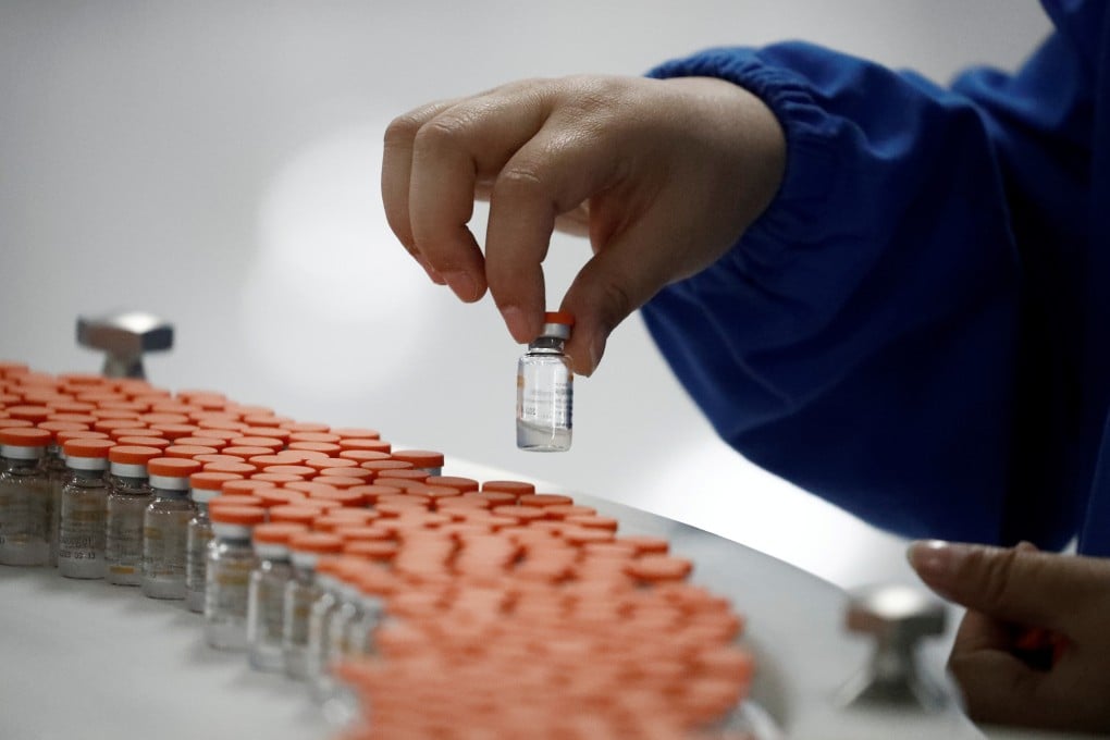A worker performs a quality check at a Sinovac packaging facility in Beijing in September. Photo: Reuters