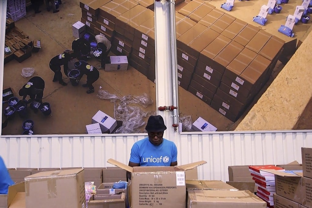 At work inside the Unicef warehouse, the world’s largest for humanitarian aid, in Copenhagen last week. Unicef began laying the groundwork for the Covax programme months ago. Photo: AP